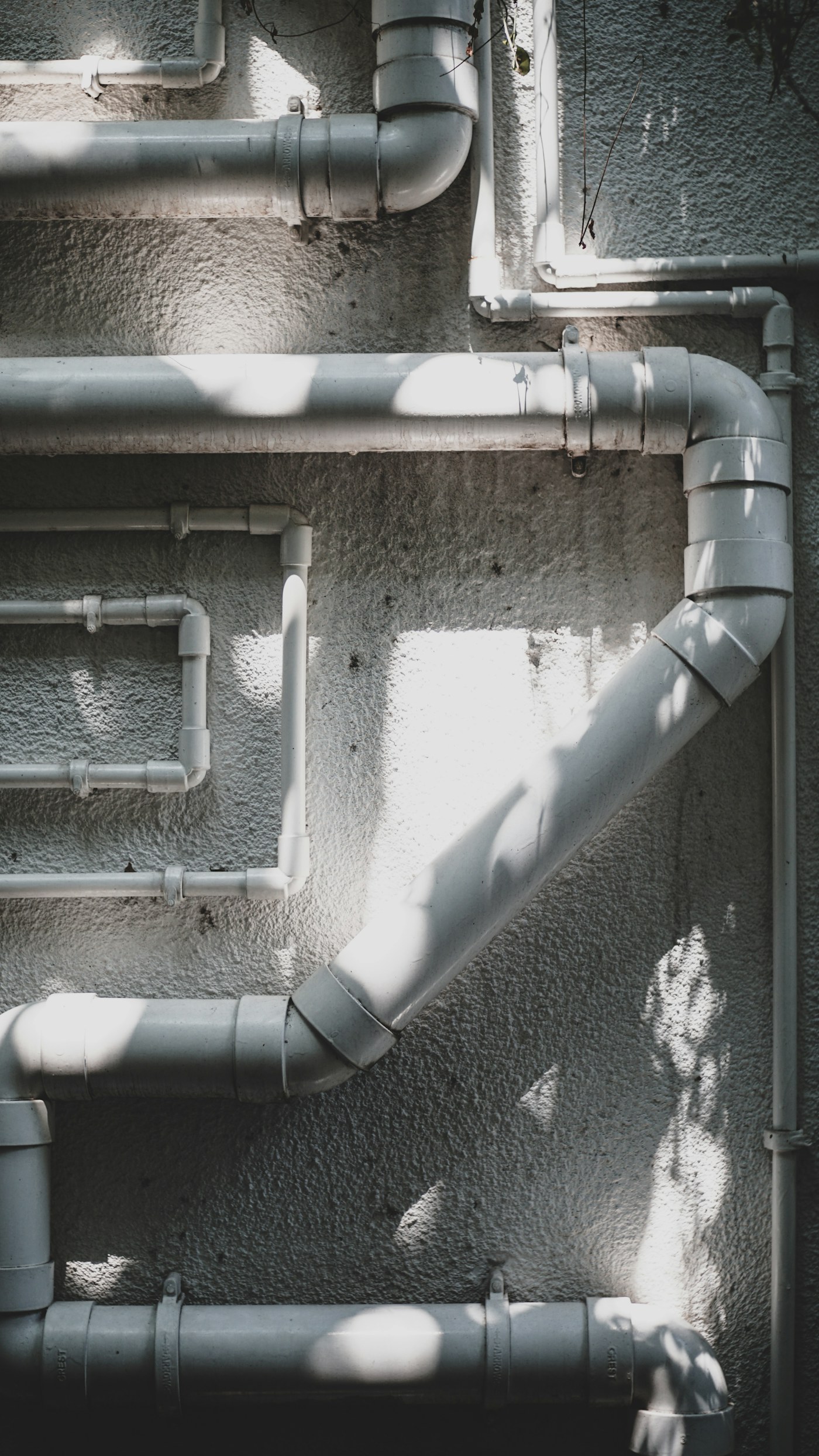 Plumbing tools and pipework in a professional service setting